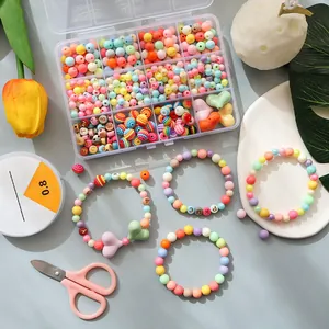 DIY jewelry making kit with colorful macaron beads, elastic cord and pink scissors