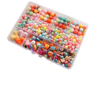 Detailed view of DIY colorful bead set in 12-grid storage box for jewelry making