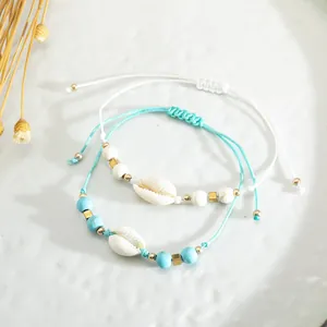 Braccialetti di conchiglie intrecciati a mano con perline blu e cordino regolabile