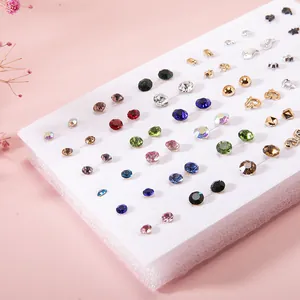 Close-up of 36 pairs colorful resin and rhinestone fruit heart stud earrings set for kids