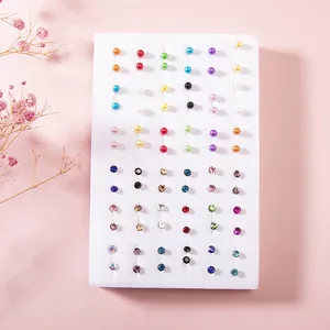 Detail of 36 pairs set with mixed color resin pearls and sparkling crystal stud earrings