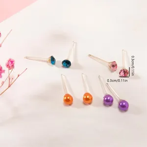 Detail shot of 3mm colorful resin stud earrings with hypoallergenic plastic posts