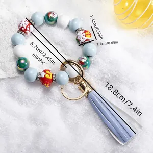 Detail of Christmas silicone bead keychain with tassel, showing 6.2cm elastic inner diameter