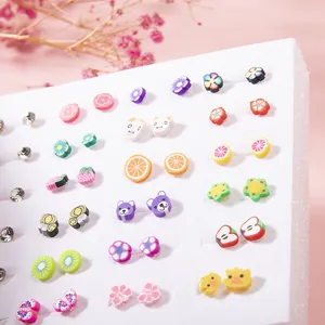 Detailed view of colorful resin fruit and flower stud earrings set for kids on display
