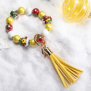 Beaded Santa silicone wristlet keychain with yellow leather tassel and Christmas beads