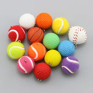 Detailed close-up of mini sports ball pendants including tennis, golf, and basketball
