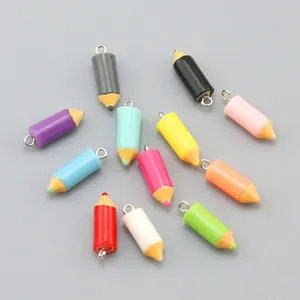 Detailed view of colorful mini resin pencil charms with metal loops for DIY sports keychains