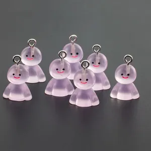 Close-up of seven translucent purple resin ghost charms with smiling faces and silver hooks