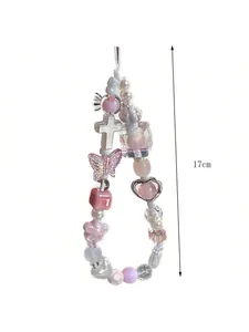 Vue détaillée du bracelet de téléphone de 17cm en perles de cristal rose avec charms cœurs