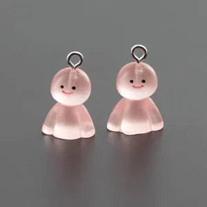 Detail of pink translucent resin ghost charms with smile face and silver metal rings