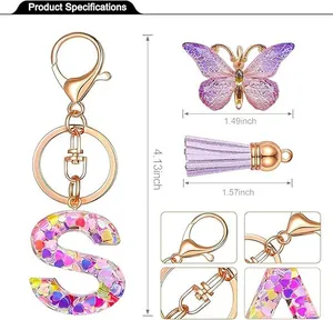 Detailed size specifications for pink sequin resin letter S keychain with purple tassel