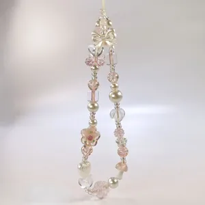 Dragonne en perles avec breloque champignon rose et nœud décoratif pour téléphones