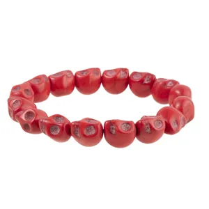 Macro shot of red skull bead bracelet with detailed gothic carvings for Halloween
