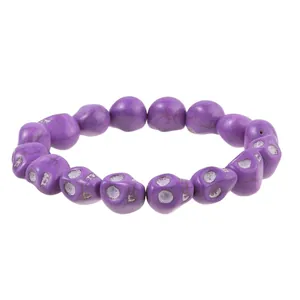 Detailed macro view of purple skull beads with black veins and gothic textures
