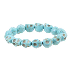 Detailed view of turquoise skull beads with natural cracked texture for gothic bracelets