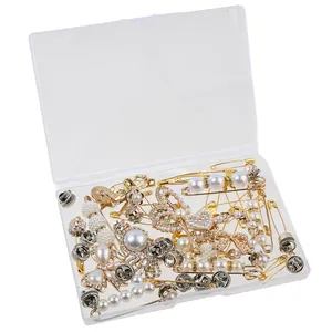 DIY bow and heart brooch pin set with pearls and rhinestones in clear plastic storage box