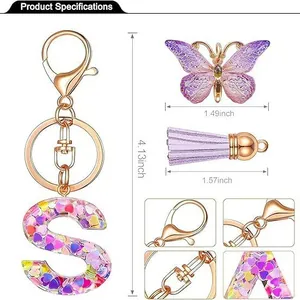Pink glitter resin letter S keychain with purple butterfly and tassel specifications