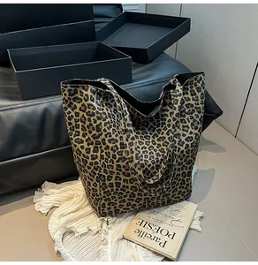 Macro view of leopard print tote bag with canvas texture on a stylish lifestyle background