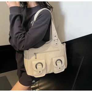 Detail of cream retro tote bag showing smooth PU leather texture and front flap pockets