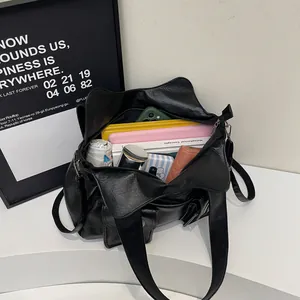 Retro black tote bag with large capacity showing phone, notebook and water bottle inside
