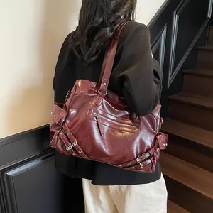 Retro burgundy studded tote bag in high-gloss faux leather with biker style accents