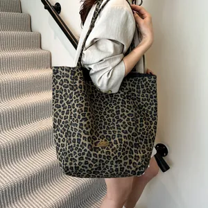 Stylish large leopard print canvas tote bag with a handmade tag for daily commute