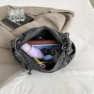 Retro denim dumpling shoulder bag with large capacity and drawstring details in dark grey