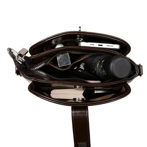 Top view of deep brown vintage crossbody bag showing multi-compartment interior storage