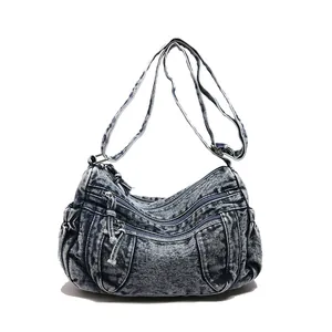 Retro denim dumpling bag with three-layer zipper pockets and adjustable shoulder strap
