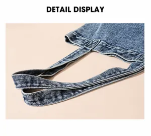 Detailansicht des weichen Tragegriffs und des gewaschenen Denim-Stoffs der Tragetasche