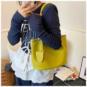 Lemon green tote bag with lychee texture shown on model for daily commuting style