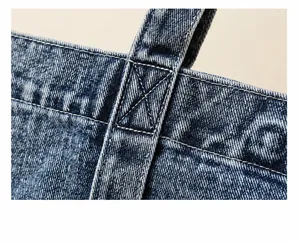 Verstärkte Nähte am Denim-Tote-Griff zeigen hochwertige Handwerkskunst