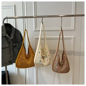 Detailed knit hobo bags in ginger, beige, and khaki with colorful bead embellishments