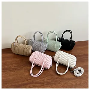 Group display of mini pleated handbags in six colors with detachable shoulder straps