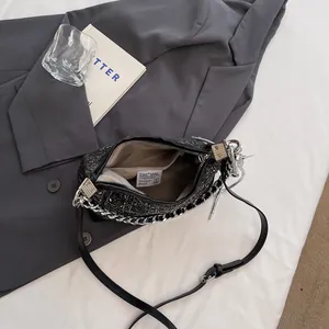Blue glitter sequins crossbody bag with silver chain and black leather shoulder strap