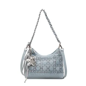 Blue denim crossbody bag with silver rhinestone lattice design and star metal charms