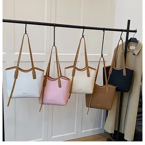 Collection of minimalist tote bags in five colors with textured synthetic leather finish