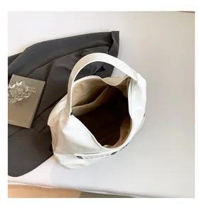 Top view of white large capacity tote bag showing spacious interior and inner pocket