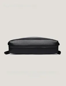 Detail view of the black lychee pattern leather bag base with professional stitching