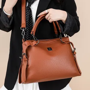 Brown litchi grain leather tote bag with wide strap for stylish commuter women