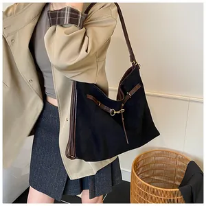 Retro black suede tote bag with brown leather straps and gold buckle detail
