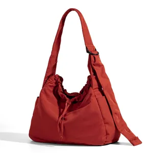 Minimalist large capacity burnt orange hobo bag with adjustable strap and drawstring design