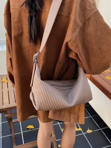 Pleated hobo shoulder bag in taupe with chic wrinkled texture for autumn fashion