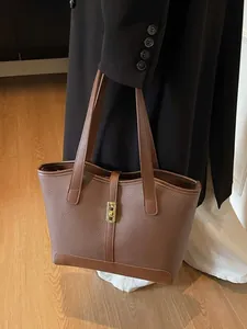 Brown lychee texture leather tote bag with gold metal buckle for women's daily commute