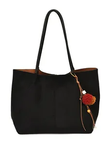 Minimalist black suede tote bag with colorful pom-pom tassels for women's casual work commute