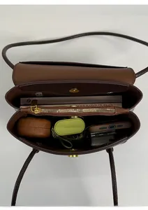 Detail view of the brown bucket bag internal compartments and large storage capacity