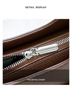Detail view showing silver metal zipper and dark brown lychee pattern leather texture
