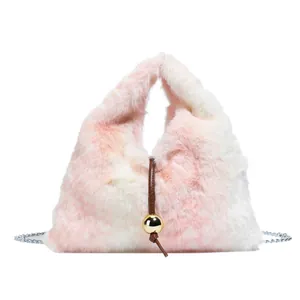 Pink and white gradient plush triangular handbag with gold ball charm and chain strap