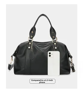 Black pebbled leather tote bag size comparison with a 6.3 inch smartphone