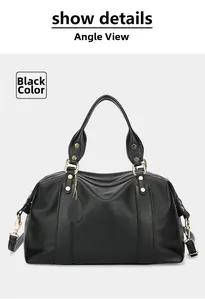Detail of black pebbled leather Boston bag with V-shaped stitching and gold hardware